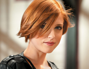 woman with short fall red hairstyle