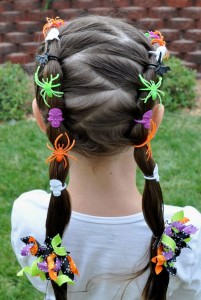 Young Girl with pigtails and spider accessories on it
