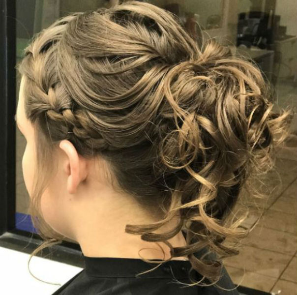 woman with braid and low ponytail with curls.