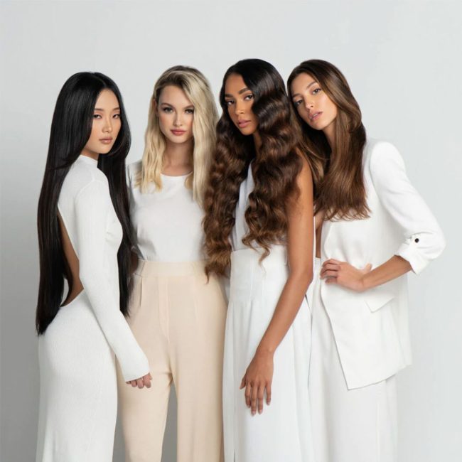 Picture of four women all with gorgeous hair standing next to each other