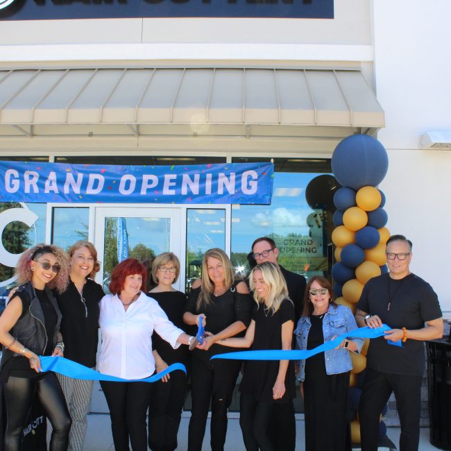 Image or ribbon cutting in front of new Hair Cuttery Salon.
