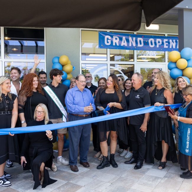 Ribbon cutting ceremony in front of Hair Cuttery salon.