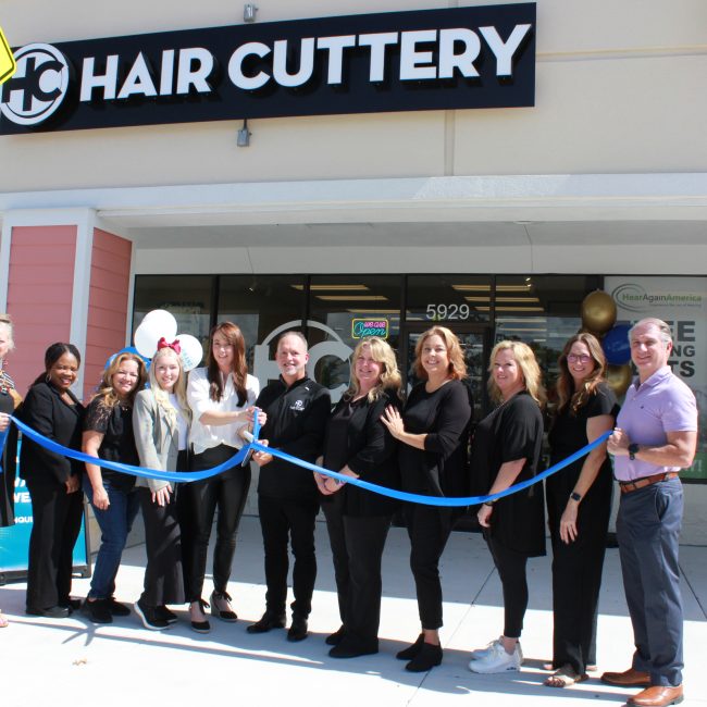 Image of ribbon cutting ceremony in front of salon.